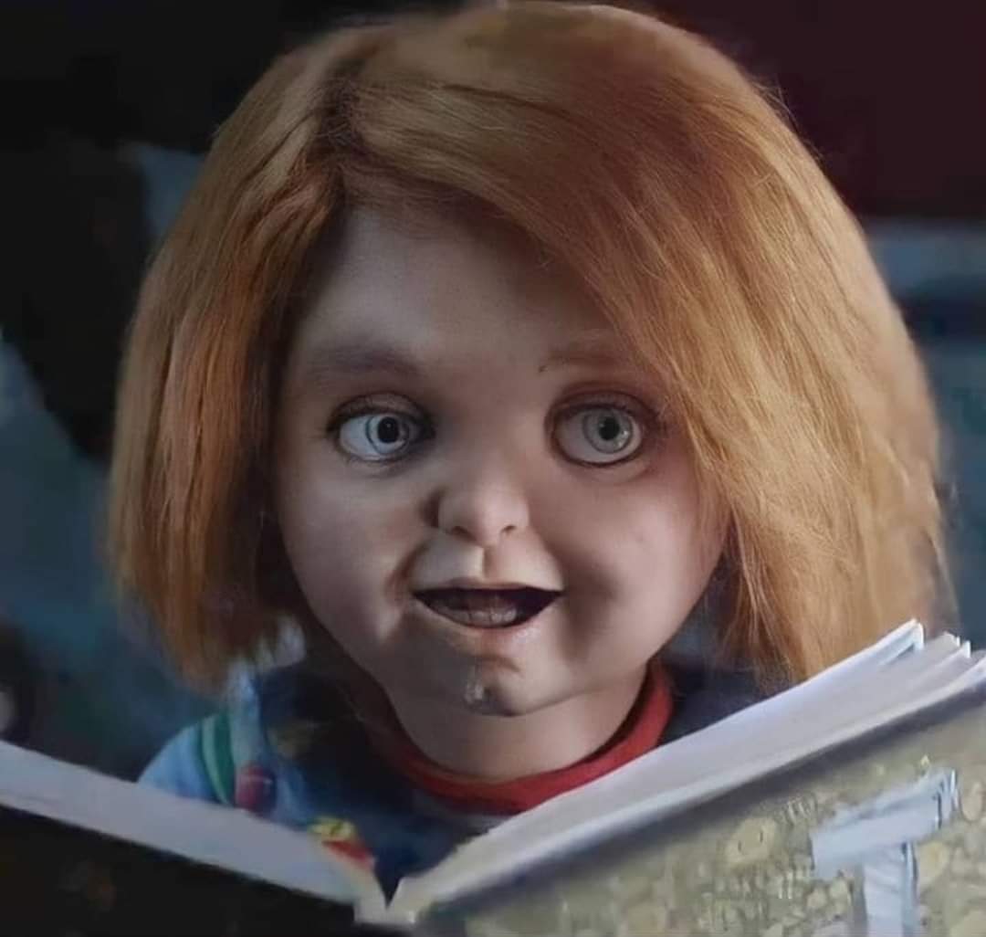 Good Guy Chucky reading a book